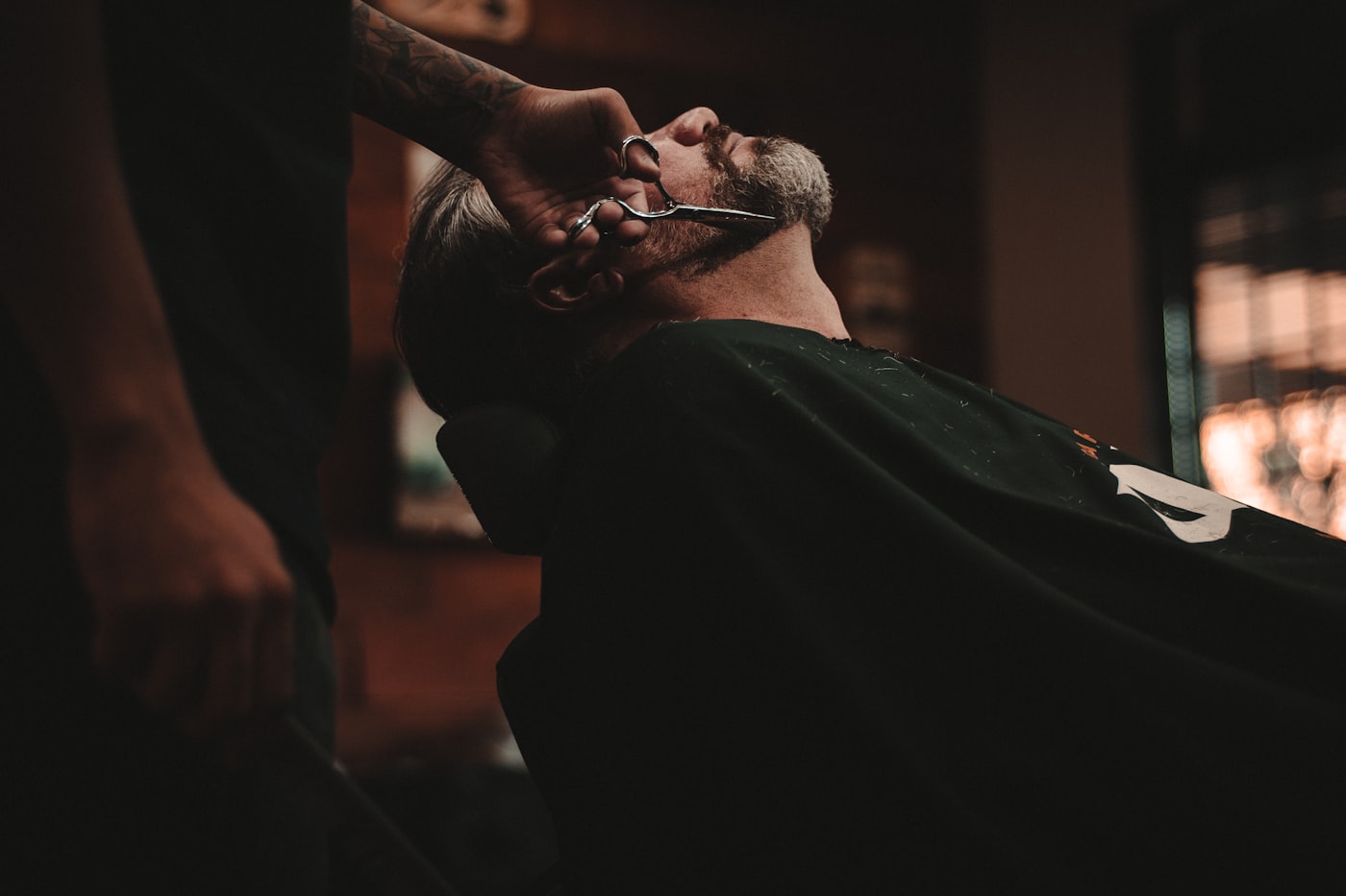 A men’s cut being finished in the chair